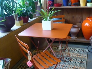 just say yes to orange - this cafe table would look great just about anywhere