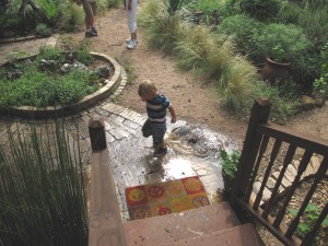 this little hobbit created a wonderful interactive water feature, right on the spot! tip over a bucket full of water and start splashing!